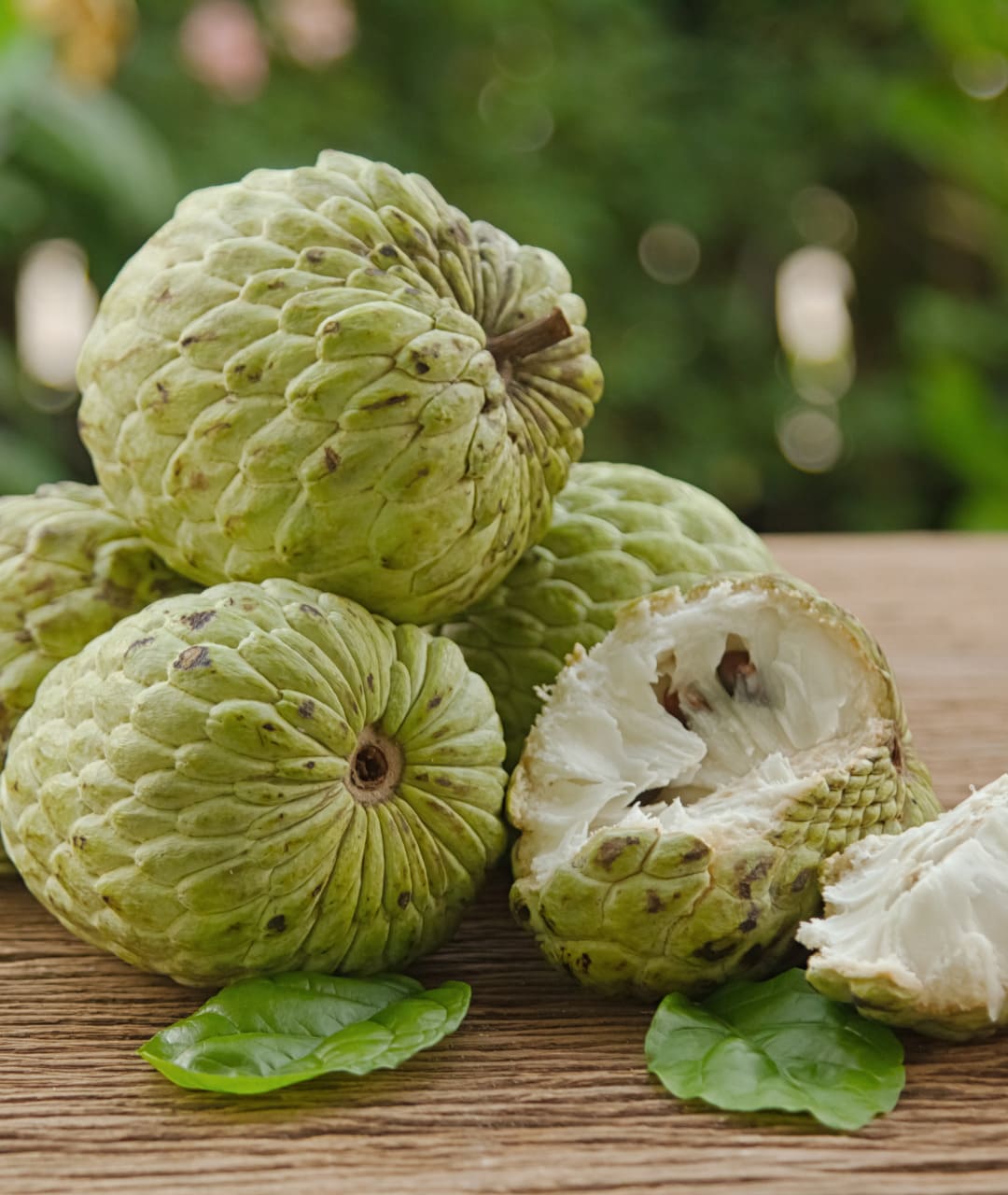 sugar apple on a table in sri lanka, the whole fruit and also pieces
